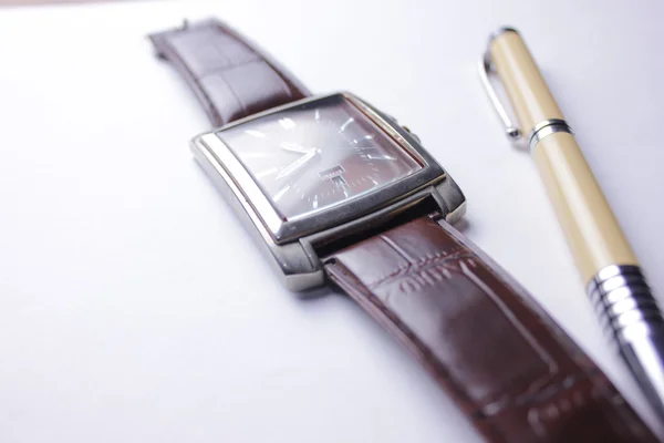 Watch and pen in white background — Stock Photo, Image