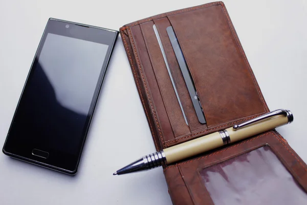 Wallet, phone, pen   on white background Stock Image