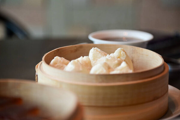 Close-up of Char Siu Bao, barbecue pork bun, BBQ pork bun. Traditional and common food in Yam Cha Culture. Chinese culture and Chinese cuisine. Food and beverage concept.