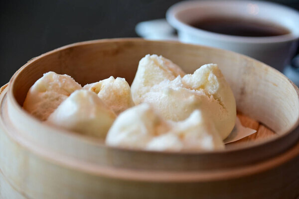 Close-up of Char Siu Bao, barbecue pork bun, BBQ pork bun. Traditional and common food in Yam Cha Culture. Chinese culture and Chinese cuisine. Food and beverage concept.