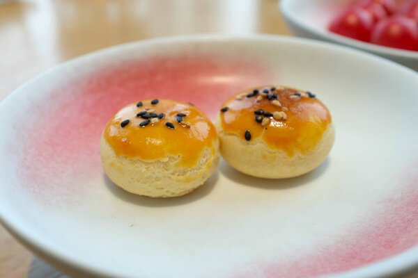 Close-up of Char Siu Puffs, BBQ Pork Puff, BBQ Pork Pastry. Traditional and common food in Yam Cha Culture. Chinese culture and Chinese cuisine. Food and beverage concept.