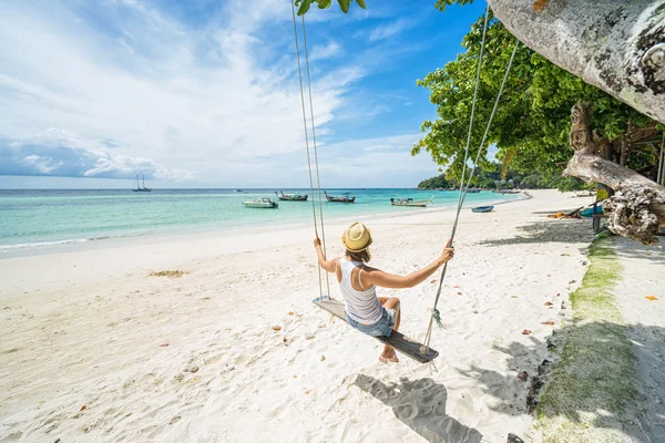 Beautiful woman swinging — Stock Photo, Image