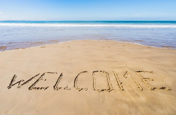 Text "welcome" on the beach — Stock Photo, Image