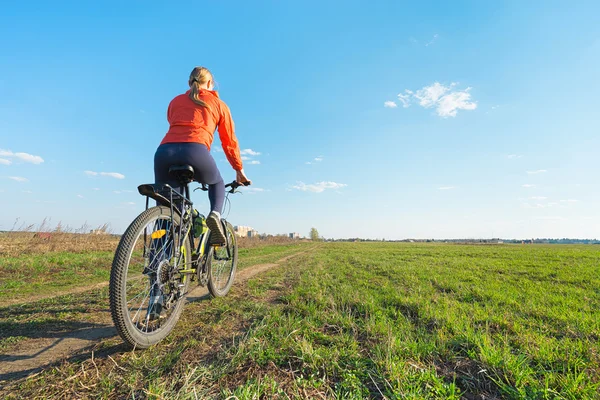 Young woman  ride on a bicycle — Stock Photo, Image