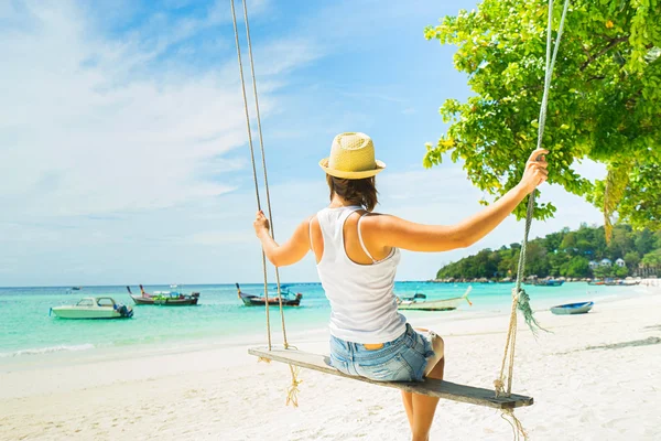 Tourist  swinging on  beach — Stock Photo, Image