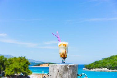 Milkshake and beautiful beach clipart