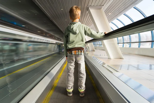 Small boy on escalator — Stock Photo, Image