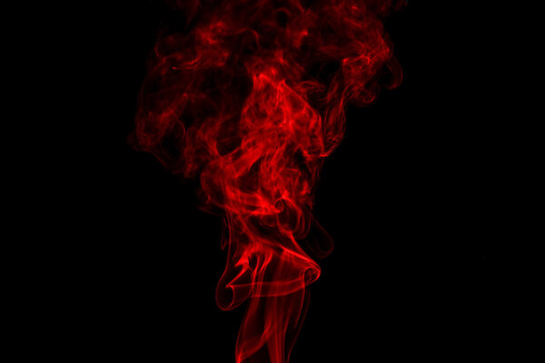 Red smoke abstract in black background isolated