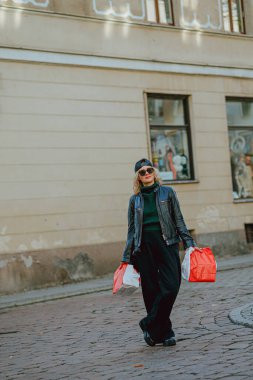 Girl holding delivery packages with space for text