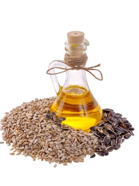 Beyaz bir arka plan ayçiçeği yağı Ayçiçeği tohumları