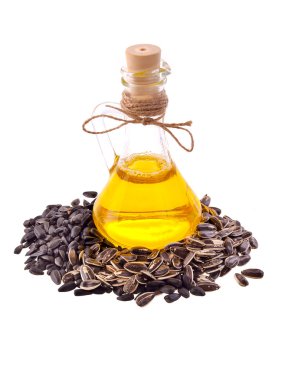 Beyaz bir arka plan Ayçiçeği tohumları ile ayçiçek yağı