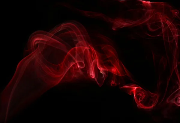 Red smoke on black background — Stock Photo, Image