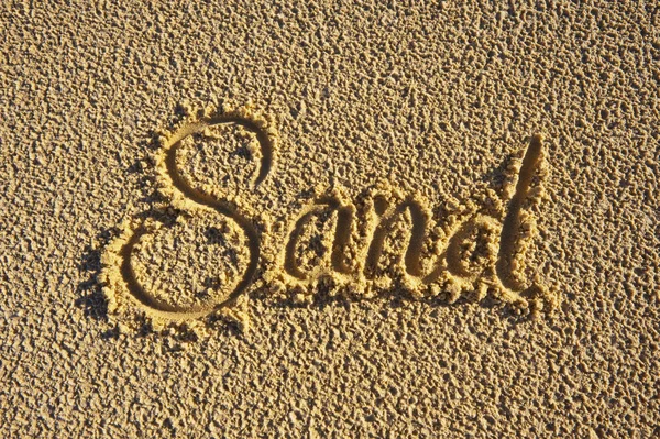 La parola 'Sabbia' scritta sulla sabbia — Foto Stock