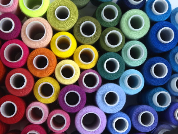 colored threads and needles for sewing equipment
