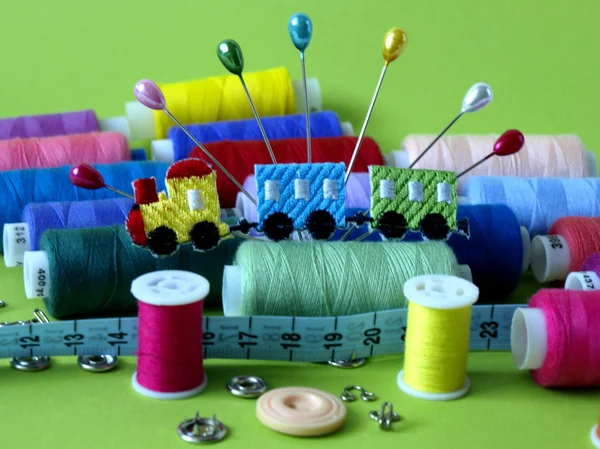 Colored threads and needles for sewing equipment — Stock Photo, Image