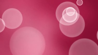 Süzülen Çemberler ve Yumuşak Işıklı Soyut Pembe Bokeh Arkaplanı.