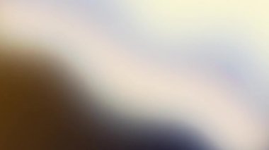 Yumuşak ışık ve renk eğimleriyle soyut bulanık arkaplan.