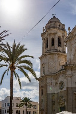 Beautiful view of a city on the Atlantic coast. A historic old town brimming with history and life. A beautiful view of the Cathedral from the waterfront promenade in Cadiz, Andalusia, Spain