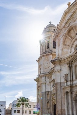 Beautiful view of a city on the Atlantic coast. A historic old town brimming with history and life. A beautiful view of the Cathedral from the waterfront promenade in Cadiz, Andalusia, Spain