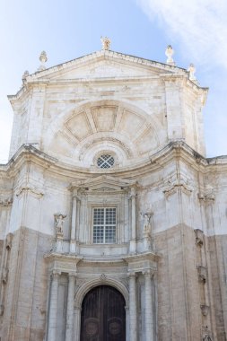 Beautiful view of a city on the Atlantic coast. A historic old town brimming with history and life. A beautiful view of the Cathedral from the waterfront promenade in Cadiz, Andalusia, Spain