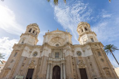 Beautiful view of a city on the Atlantic coast. A historic old town brimming with history and life. A beautiful view of the Cathedral from the waterfront promenade in Cadiz, Andalusia, Spain