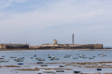An old, historic city. Harbor, city beach and fortress of Cdiz, Andalusia, Atlantic coast, Spain.