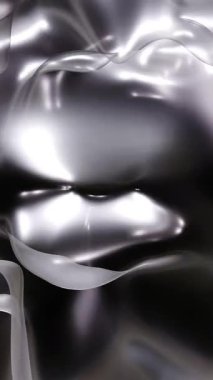 Parlak metalik yüzey ışık desenlerini yansıtıyor