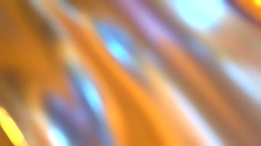 Yoğun renkli ışık girdapları yumuşak, odaklanmamış hareket bulanıklığı efektiyle yakalanır..