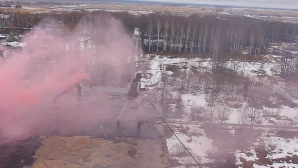 Rope jumping  with smoke sword in the hands of — Stock Video