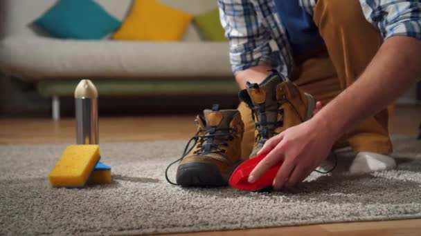 Close up man cleans shoes from dirt with a special brush — Stock video