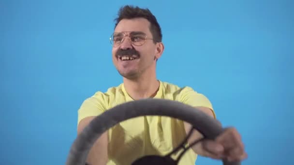 Portrait of a funny male driver with a mustache at the wheel — Stock Video