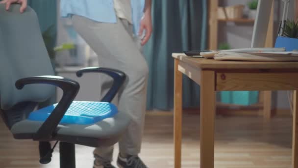 Freelancer or office worker puts a seat Cushion Pillow for Office Chair — Stock Video