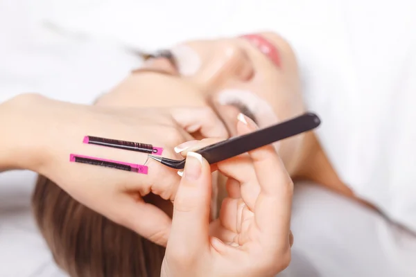 Eyelash Extension Procedure. Woman Eye with Long Eyelashes. Lashes, close up, selected focus. — Stock Photo, Image