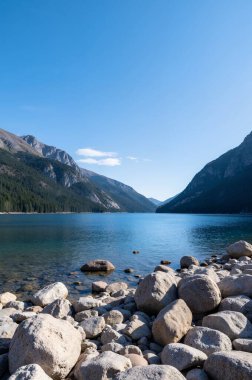 a vertical view of the beautiful lake surrounded by mountains