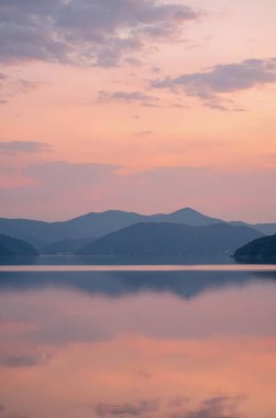 sunset on a lake. beautiful sunrise over calm sea.