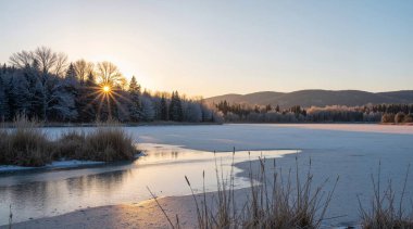 frozen lake on a background of the forest and mountains. sunrise in the morning.