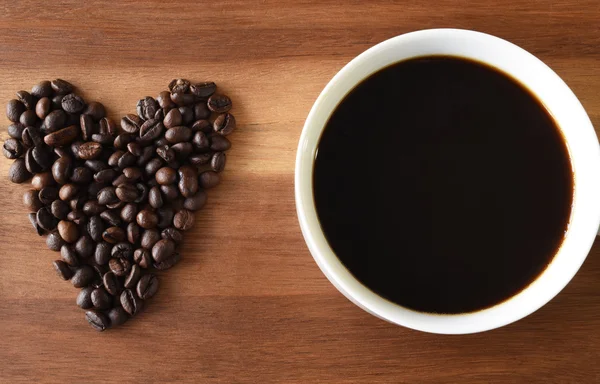 I love coffee. A cup of hot coffee with heart shape