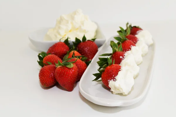 Fresh organic red strawberries with whipped cream — Stock Photo, Image