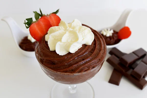 Glass of Chocolate pudding with whipped cream and strawberry