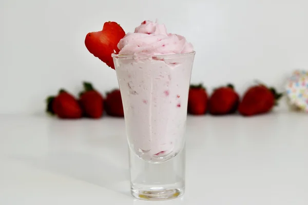 Glass of strawberry mousses with strawberry fruit Stock Picture
