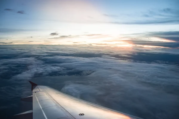 Sunrise on airplane with light flare. — Stock Photo, Image