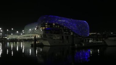 ABU DHABI, UAE - MAY 15, 2021: Illuminated W Abu Dhabi hotel in Yas Island in Abu Dhabi at night
