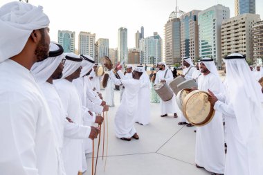 ABU DHABI, UAE - DECEMBER 14, 2019: Traditional Emirati male Al Ayalah dance at Al Hosn Festival