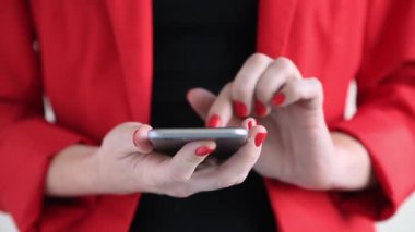 Closeup of female hands texting on smartphone, business woman typing message or email