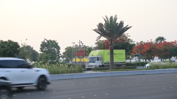 ABU DHABI, UAE - MAY 23, 2021: General view of Abu Dhabi daily traffic during golden hour. Cars passing by. — Stok video