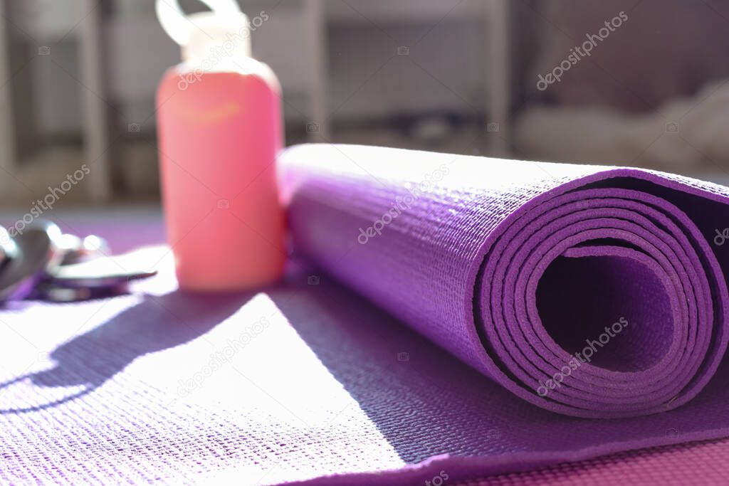 Yoga mat and gym equipment for healthy lifestyle and fitness background