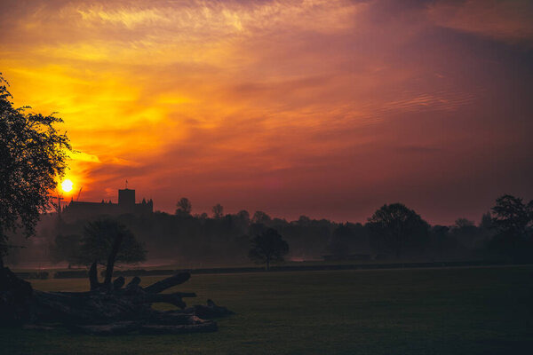 Landscape scene in a st albans park overlooking st albans cathedral with a dawn sunrise