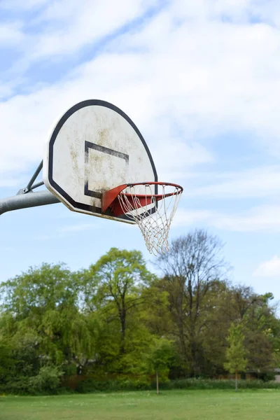 Basketball hoop with net on an outdoor basketball court