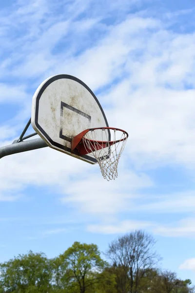 Basketball hoop with net on an outdoor basketball court