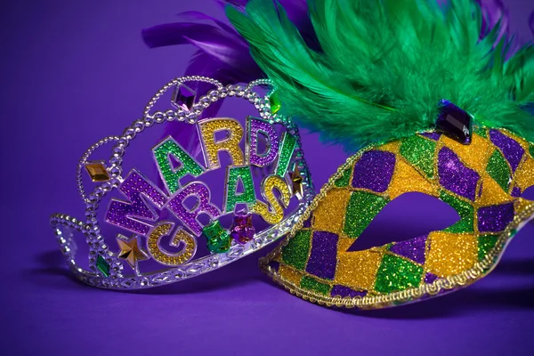 Assorted Mardi Gras or Carnivale mask on a purple background — Stock Photo, Image